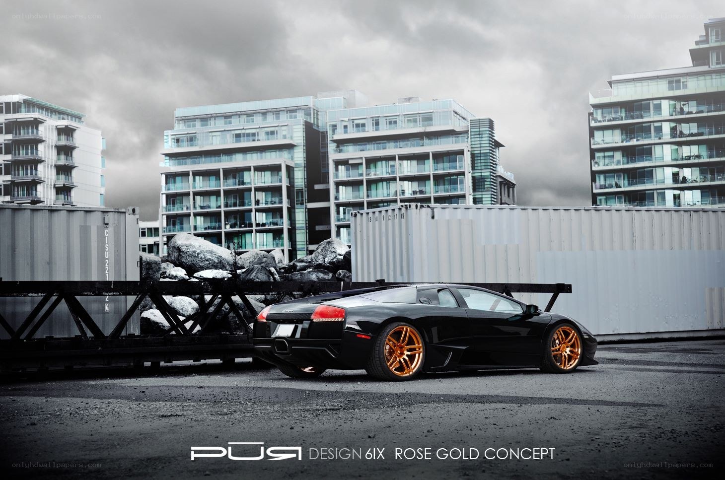 Black Lamborghini with gold wheels