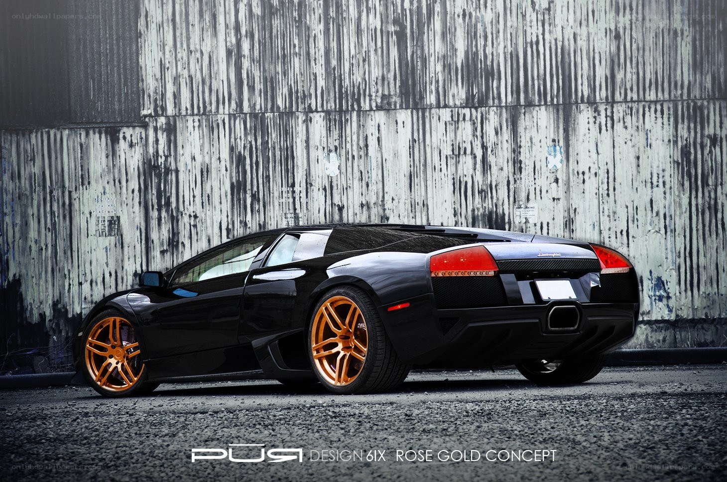 Black Lamborghini with gold wheels