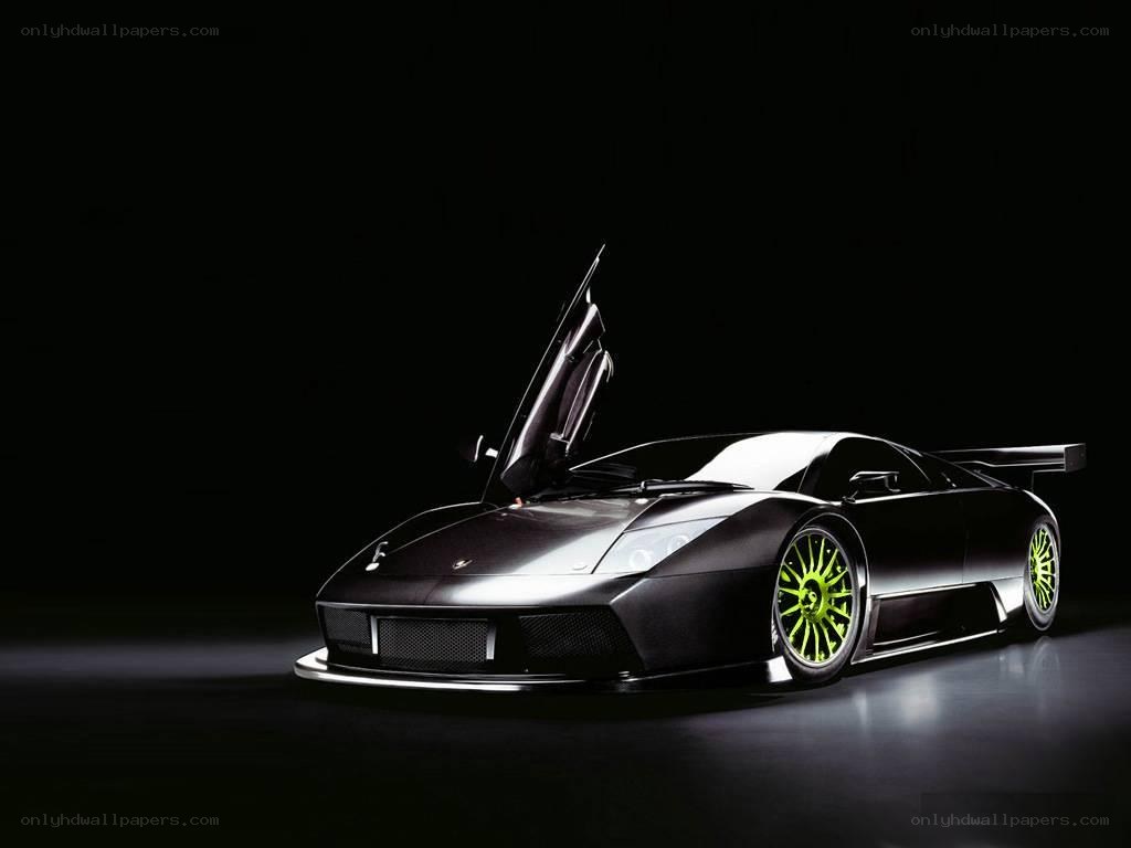 Black Lamborghini with green wheels