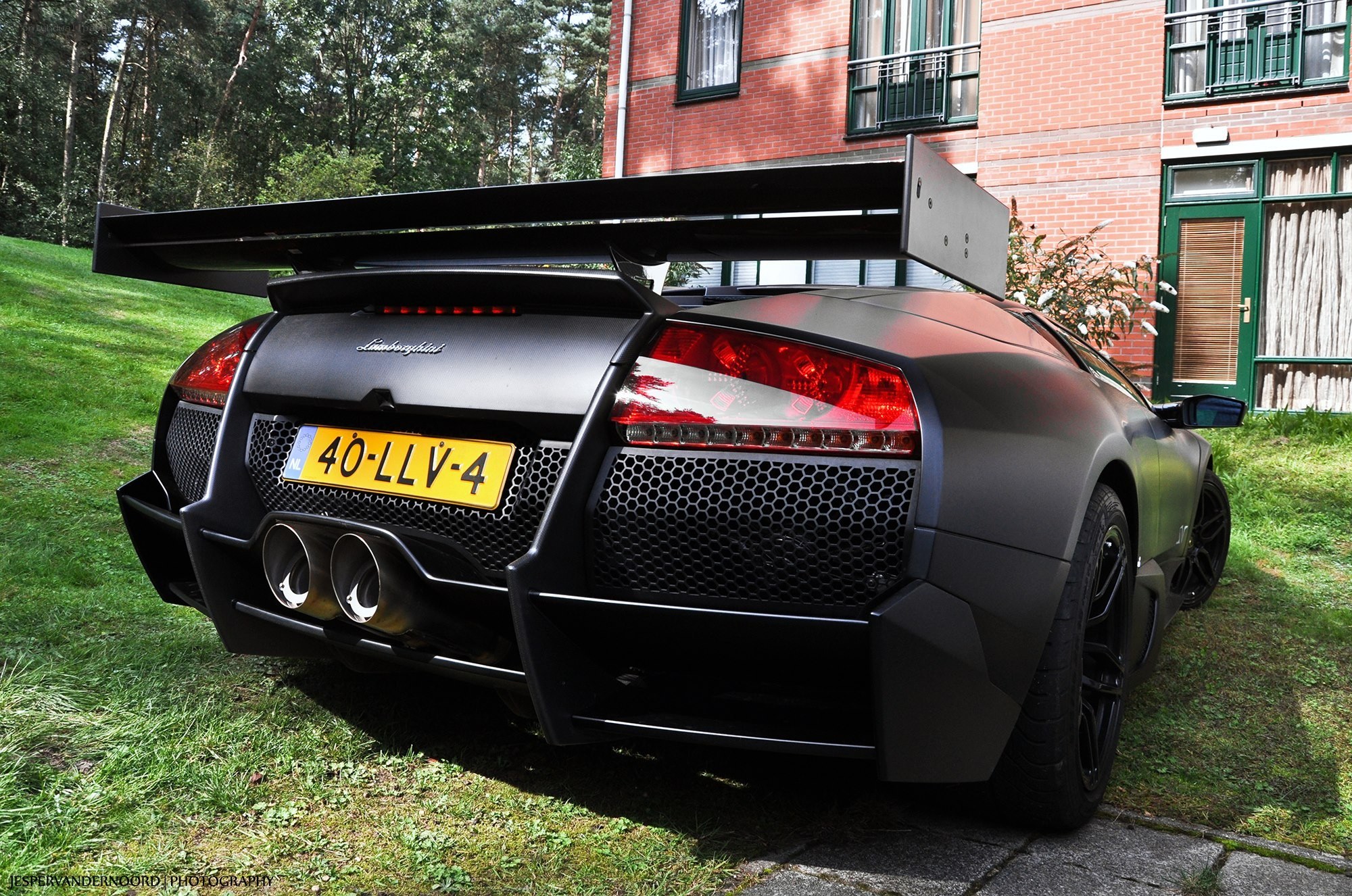 Black Lamborghini with large rear wing