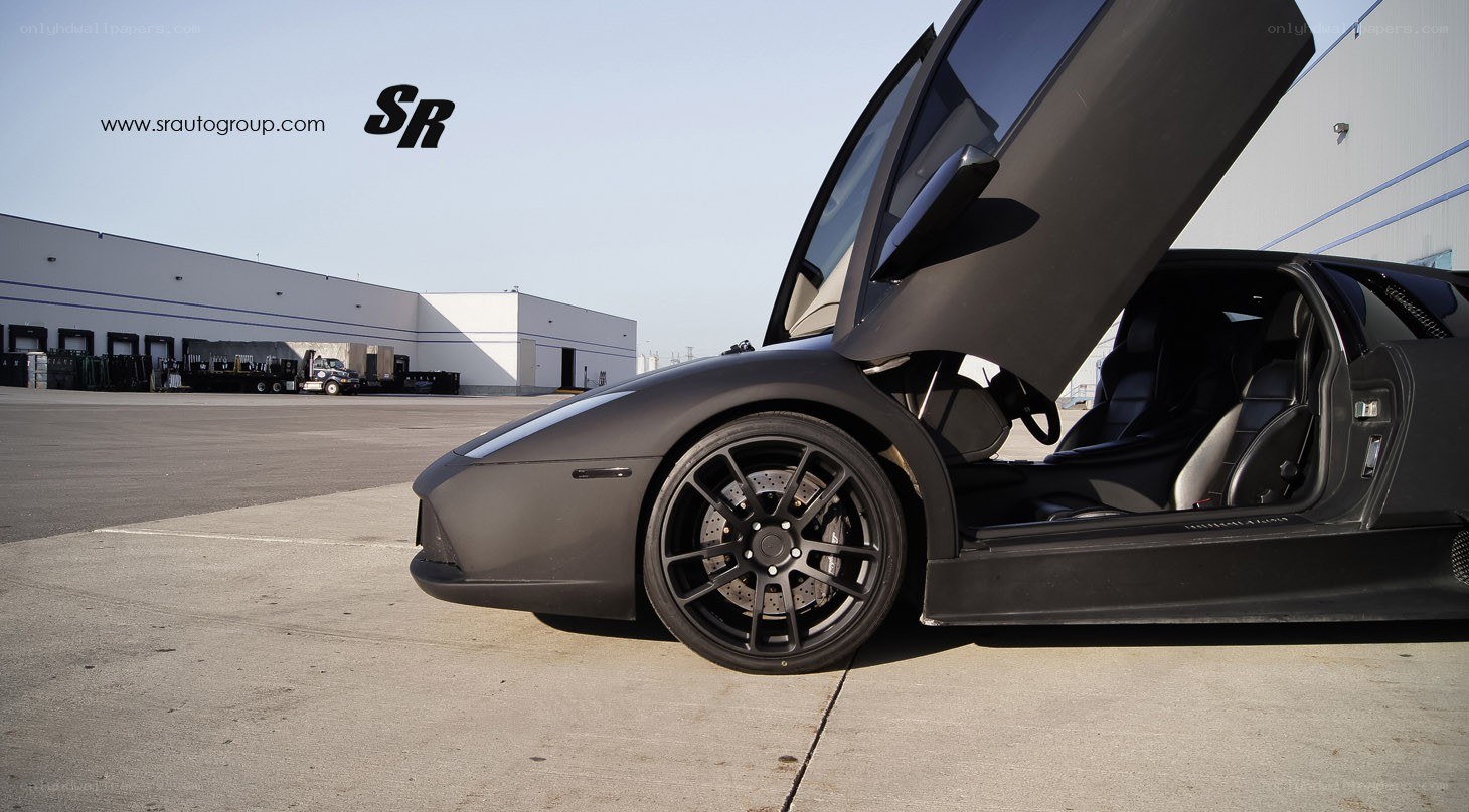 black lamborghini with open door