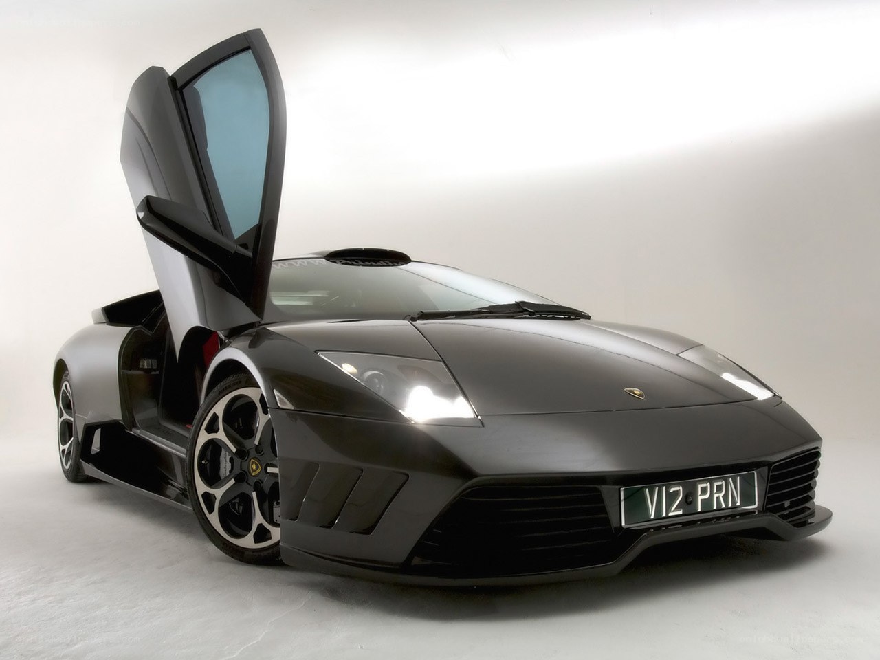 Black Lamborghini with open door