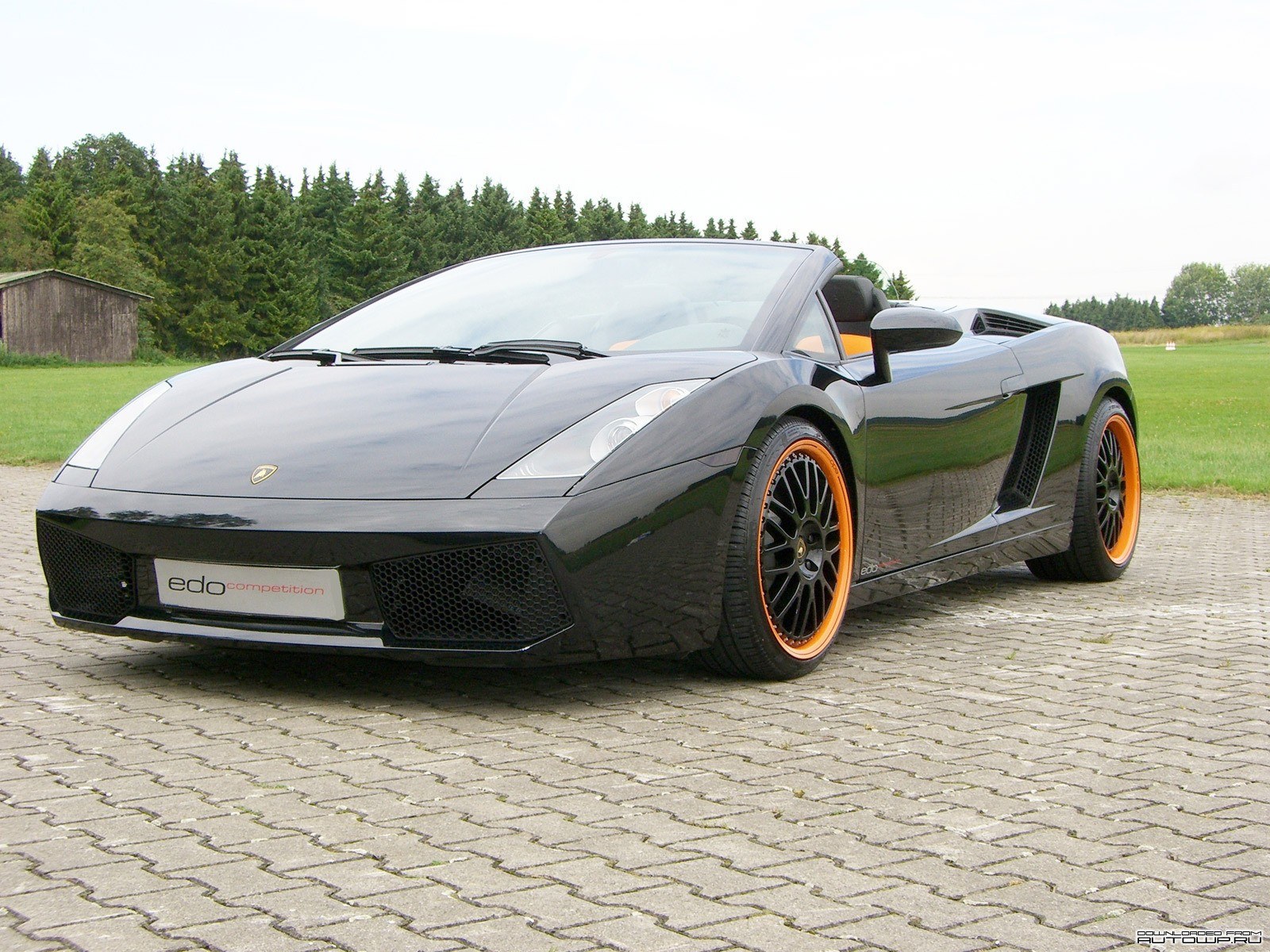 Black Lamborghini with orange wheels