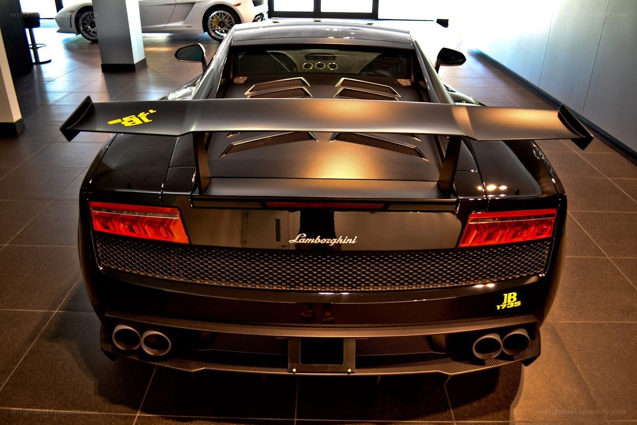 black lamborghini with rear wing