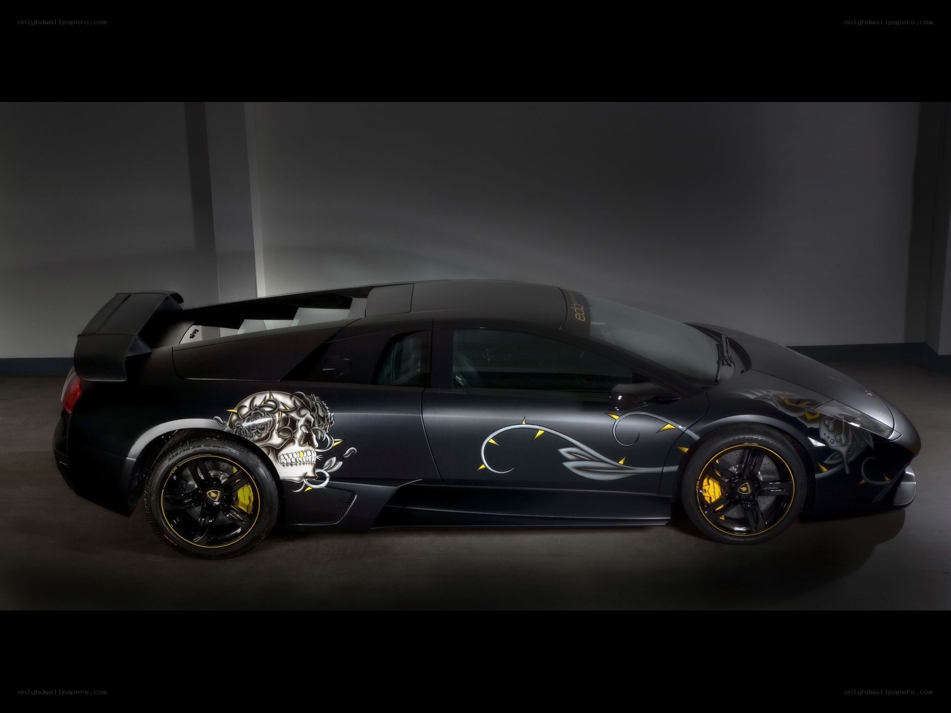 black lamborghini with skull design