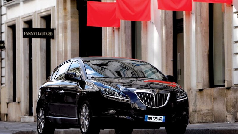 Black Lancia car on city street