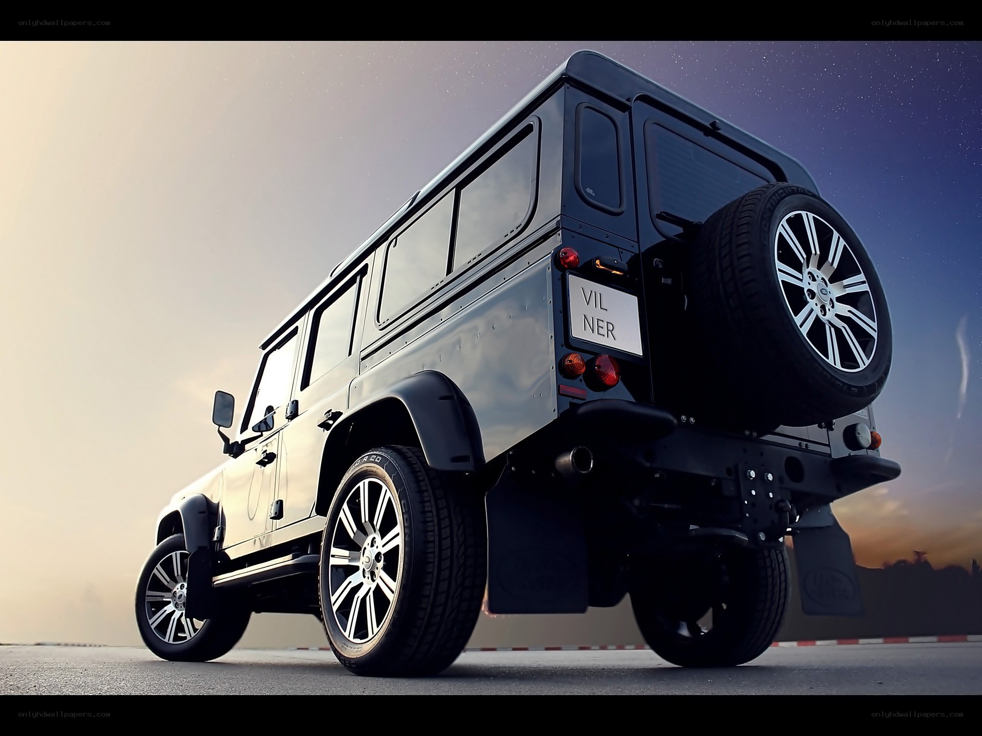 black land rover defender