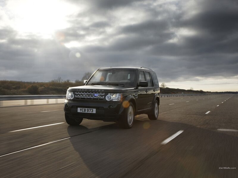 Black Land Rover Driving — Dramatic