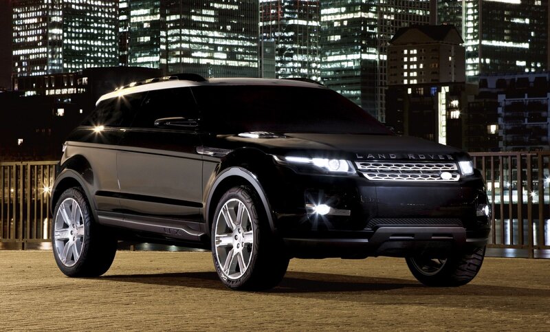 Black Land Rover in city at night