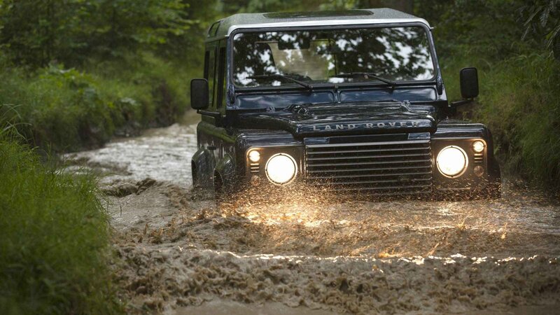 Black Land Rover in Mud