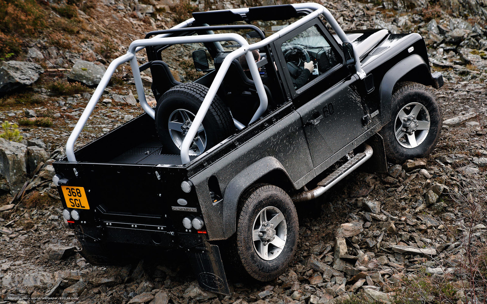 Black Land Rover off-roading