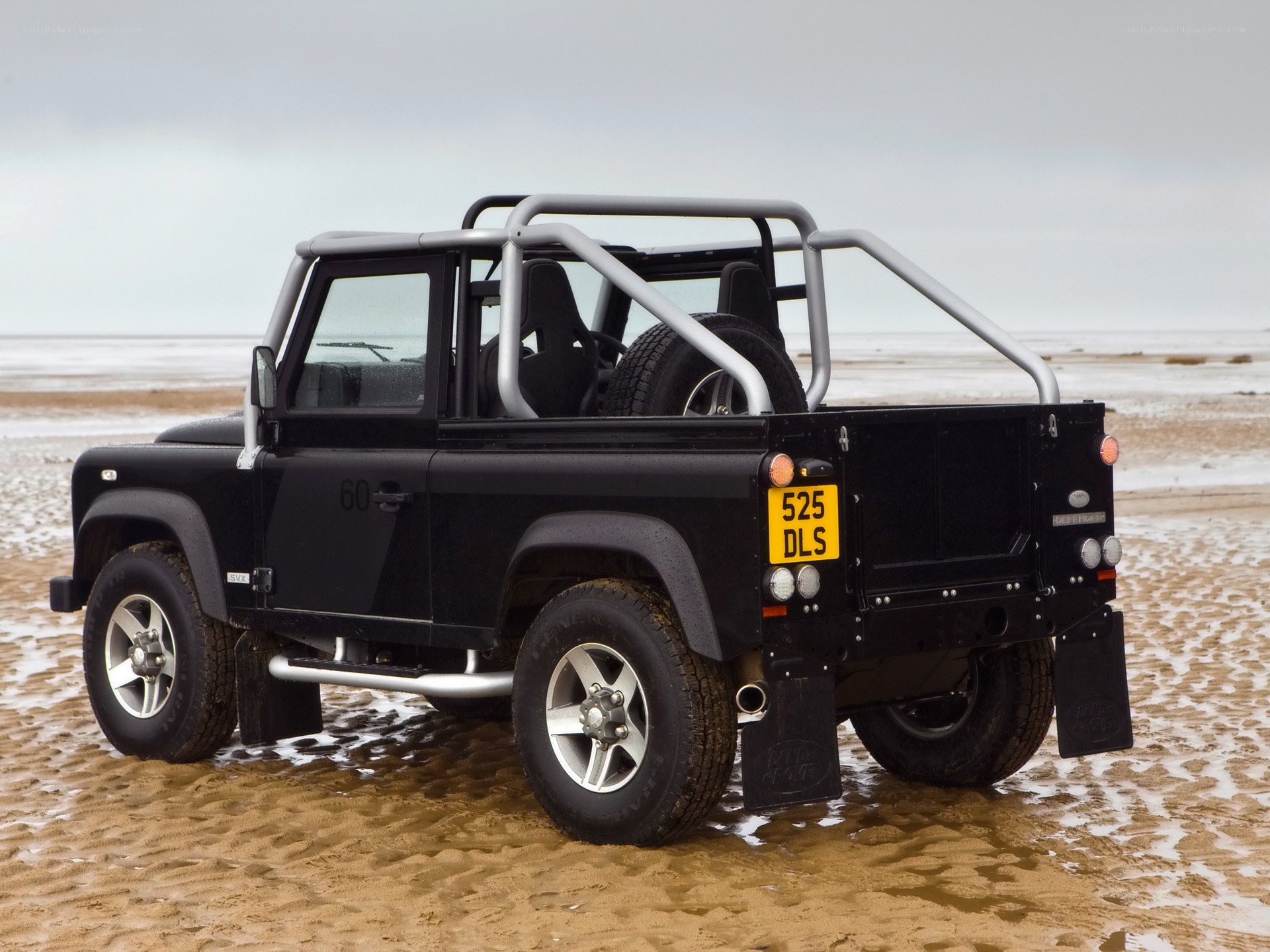 Black Land Rover on beach