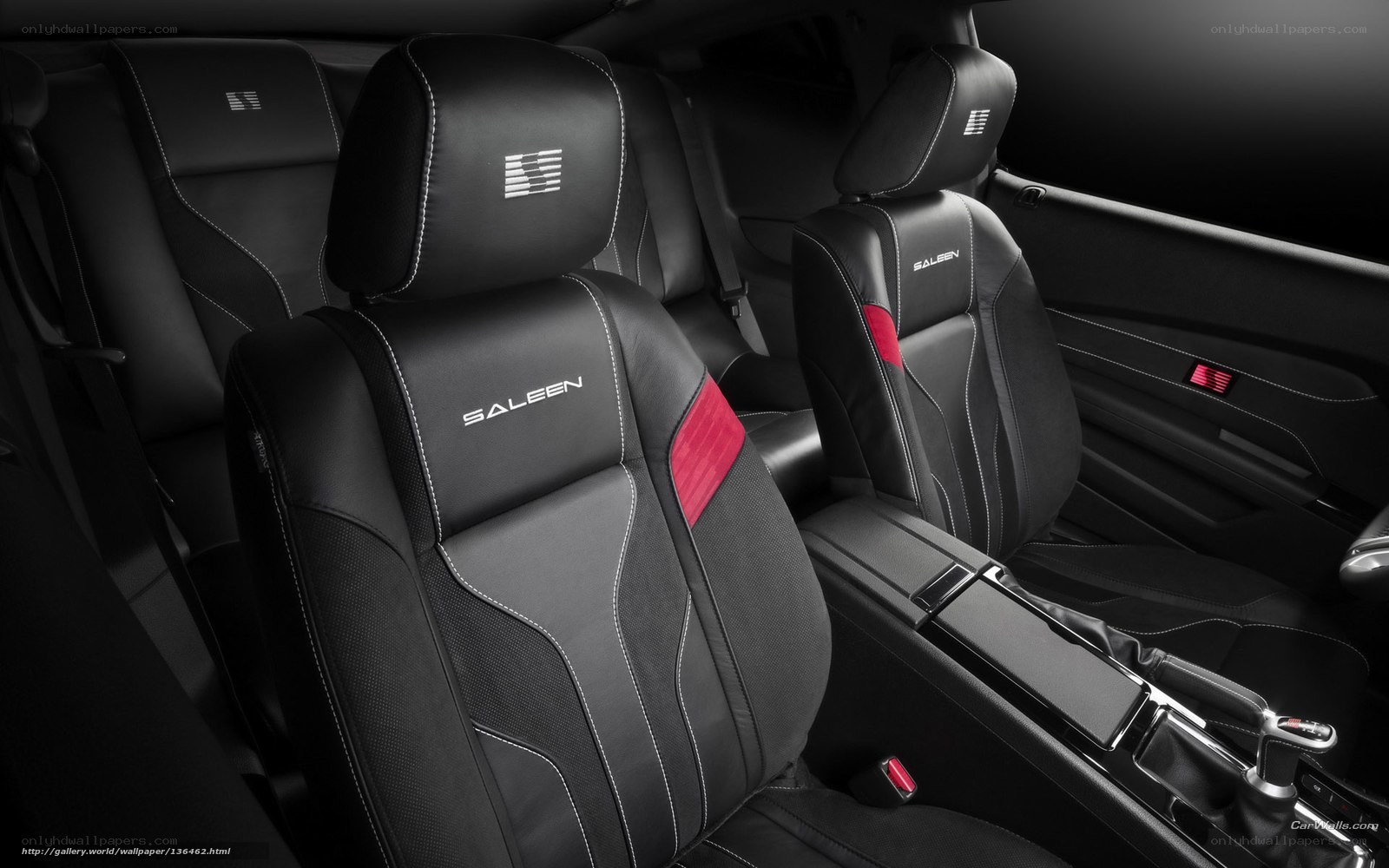 Black leather car seats with red accents