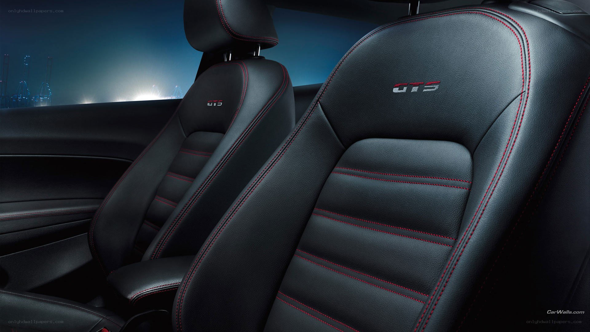 Black leather car seats with red stitching