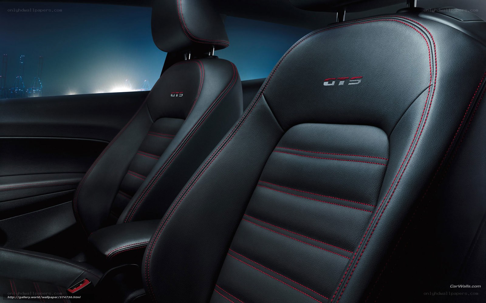 Black leather car seats with red stitching