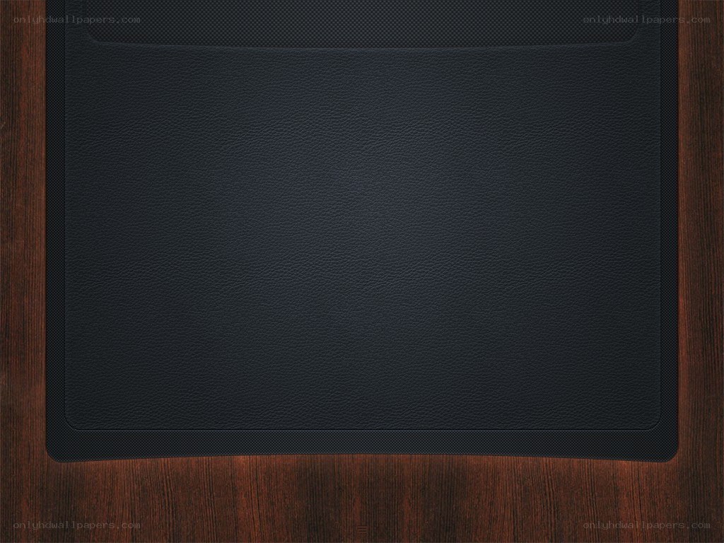 black leather surface on wood