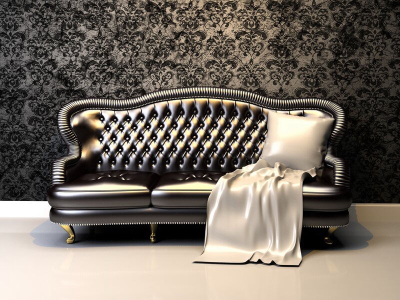 Black leather tufted sofa