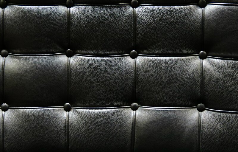 black leather tufted upholstery
