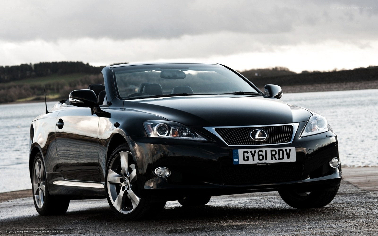 Black Lexus convertible by water