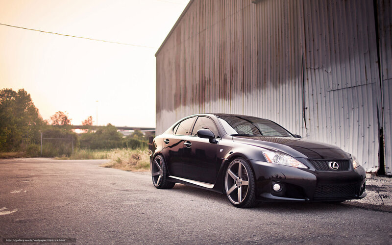 Black Lexus IS-F parked by warehouse