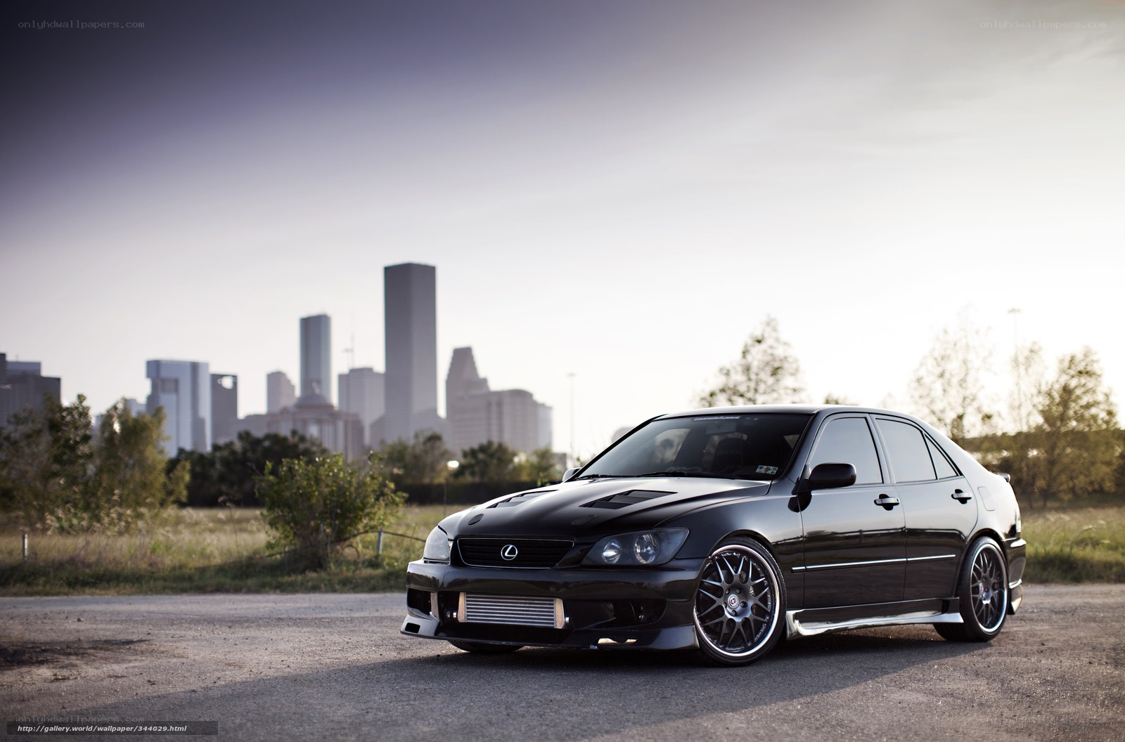 Black Lexus IS300 in cityscape