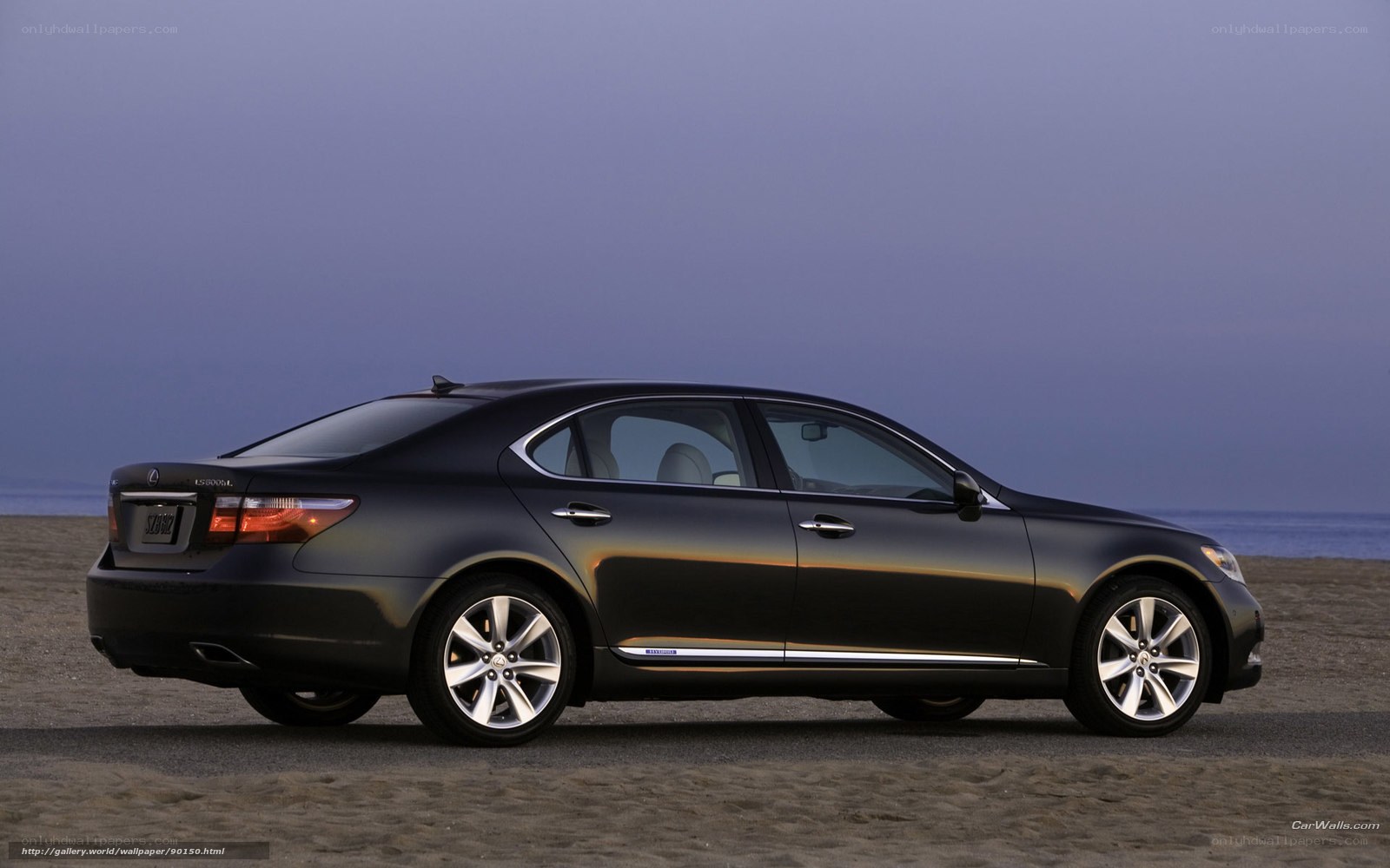 Black Lexus LS 600h on beach