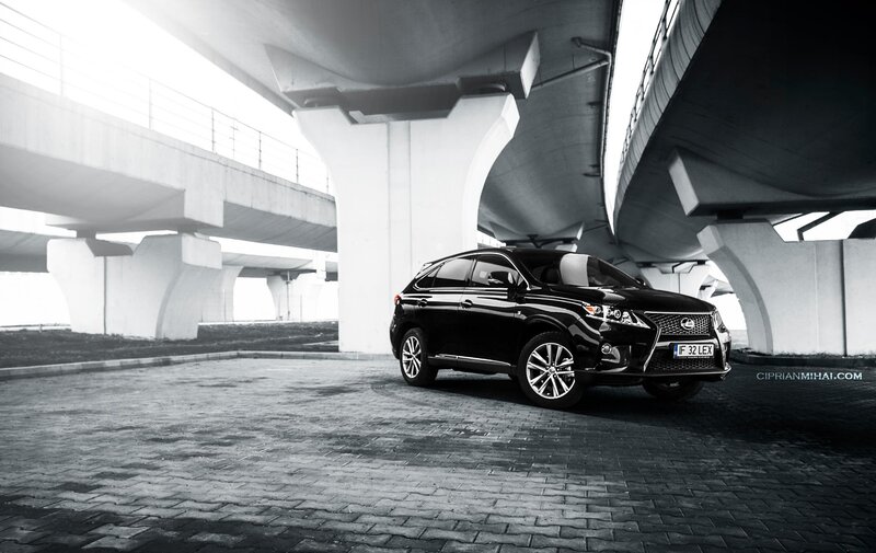 Black Lexus RX under overpass