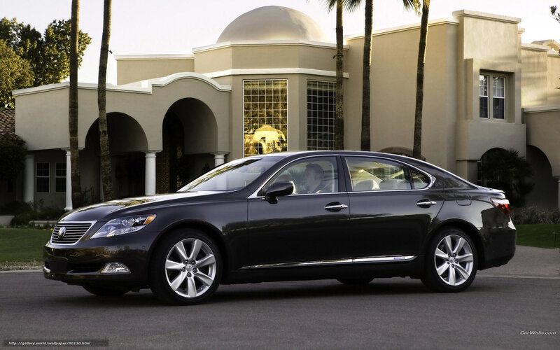 black lexus sedan in front of house
