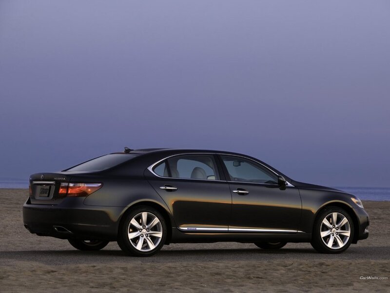 black lexus sedan on beach