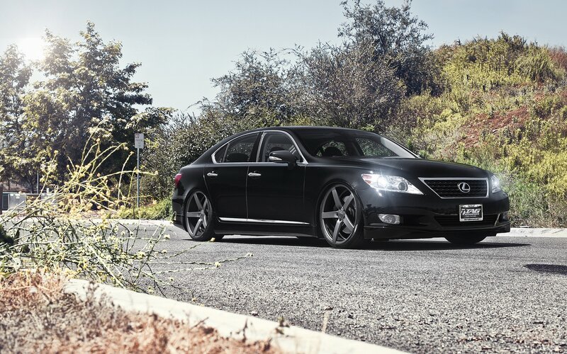 black lexus sedan on road
