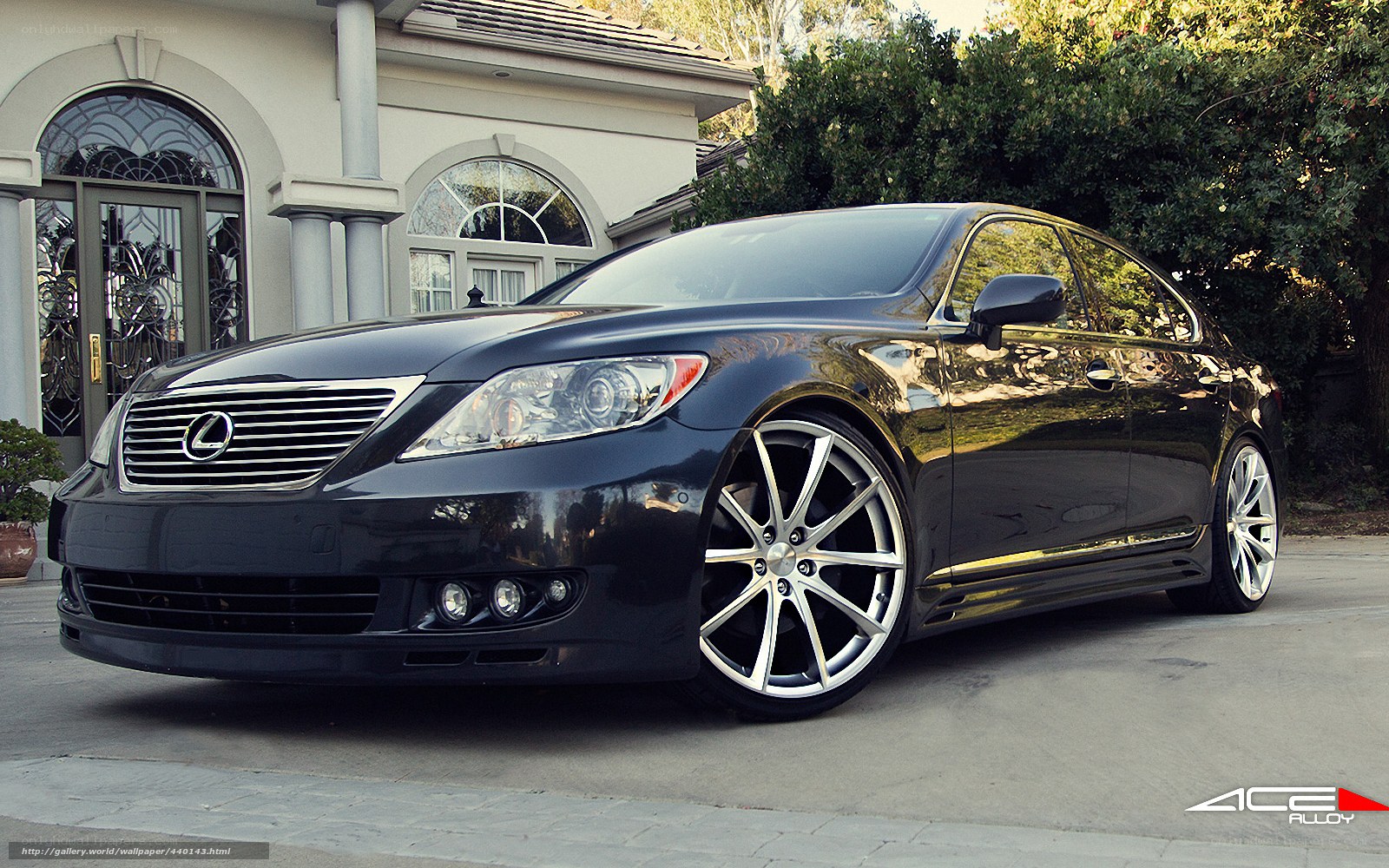 black lexus sedan with custom wheels