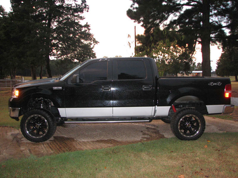 Black Lifted Pickup Truck — Calm, Sunset