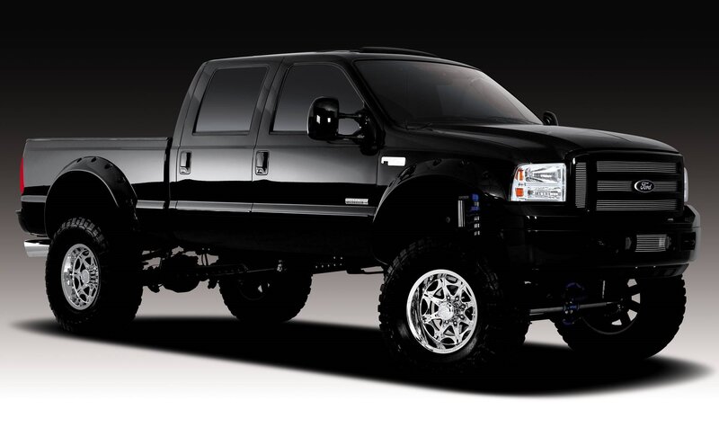 Black Lifted Pickup Truck — Dramatic