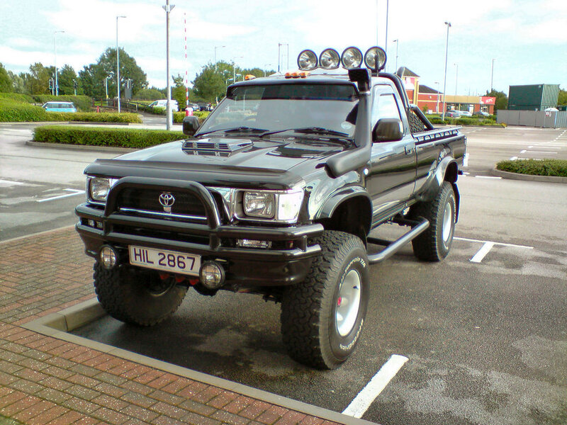 Black Lifted Pickup Truck — Neutral, Afternoon
