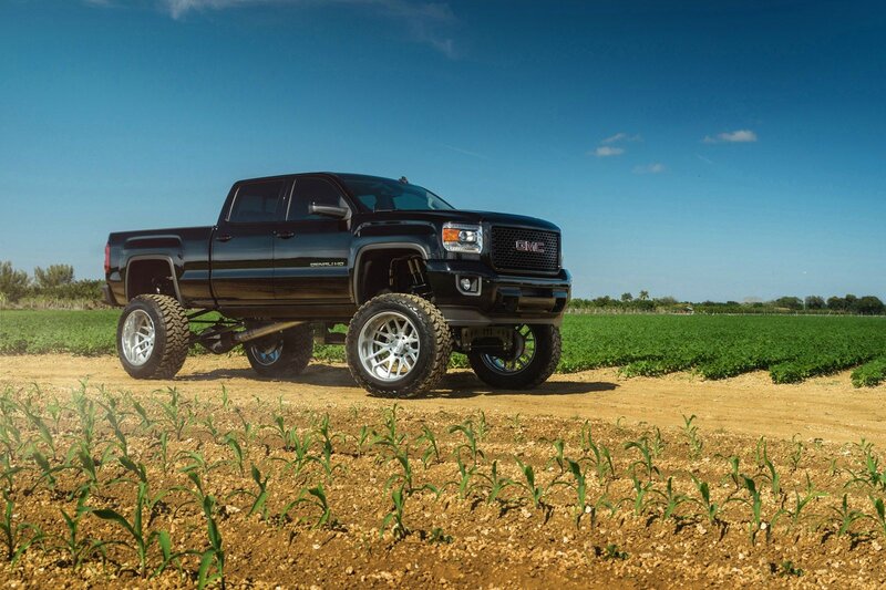 Black Lifted Truck — Blue