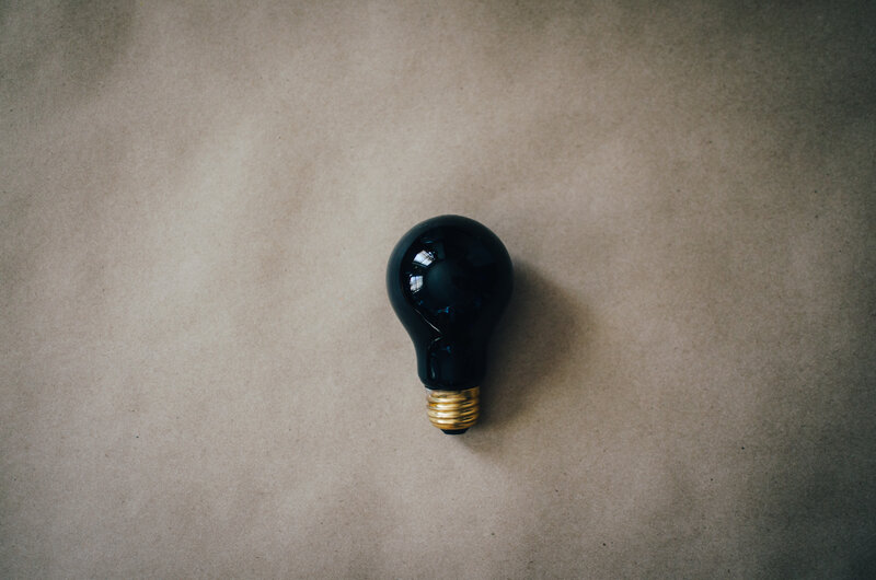 black light bulb on brown paper