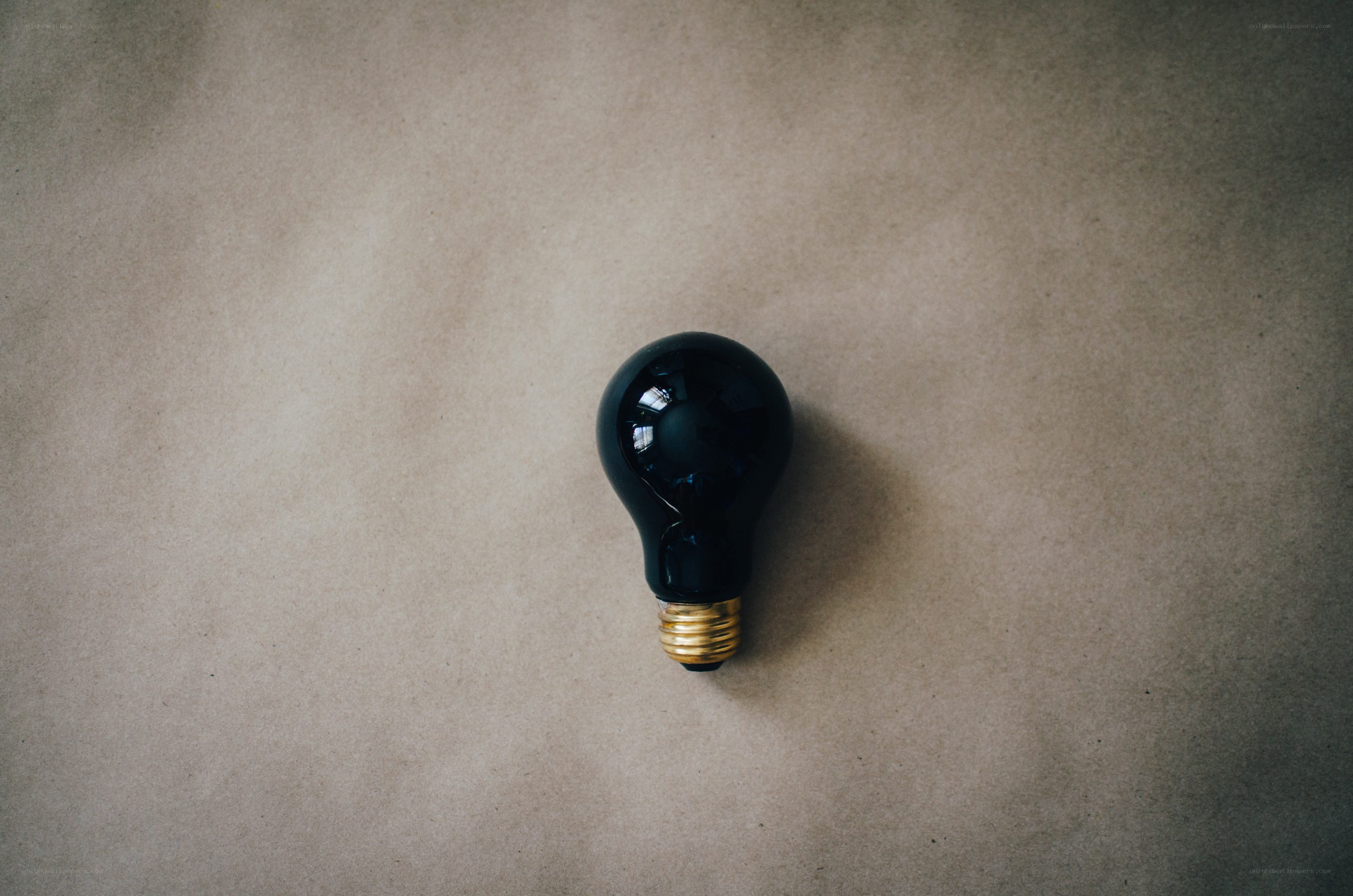 black light bulb on brown paper