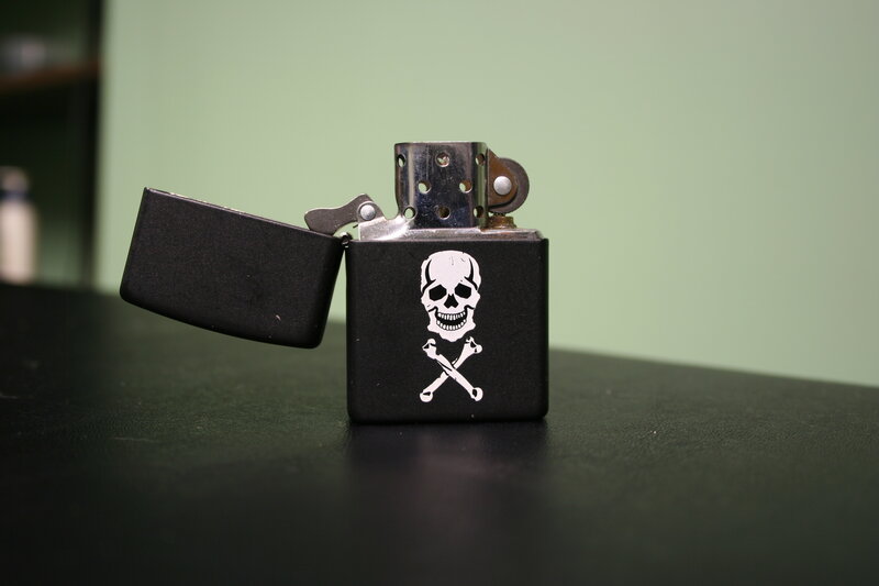 black lighter with skull design