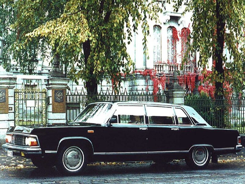 Black limousine in front of building