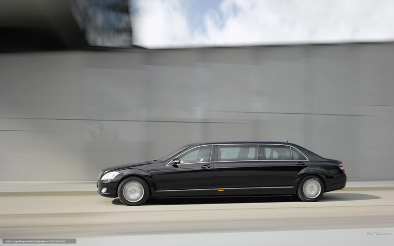 Black limousine in motion