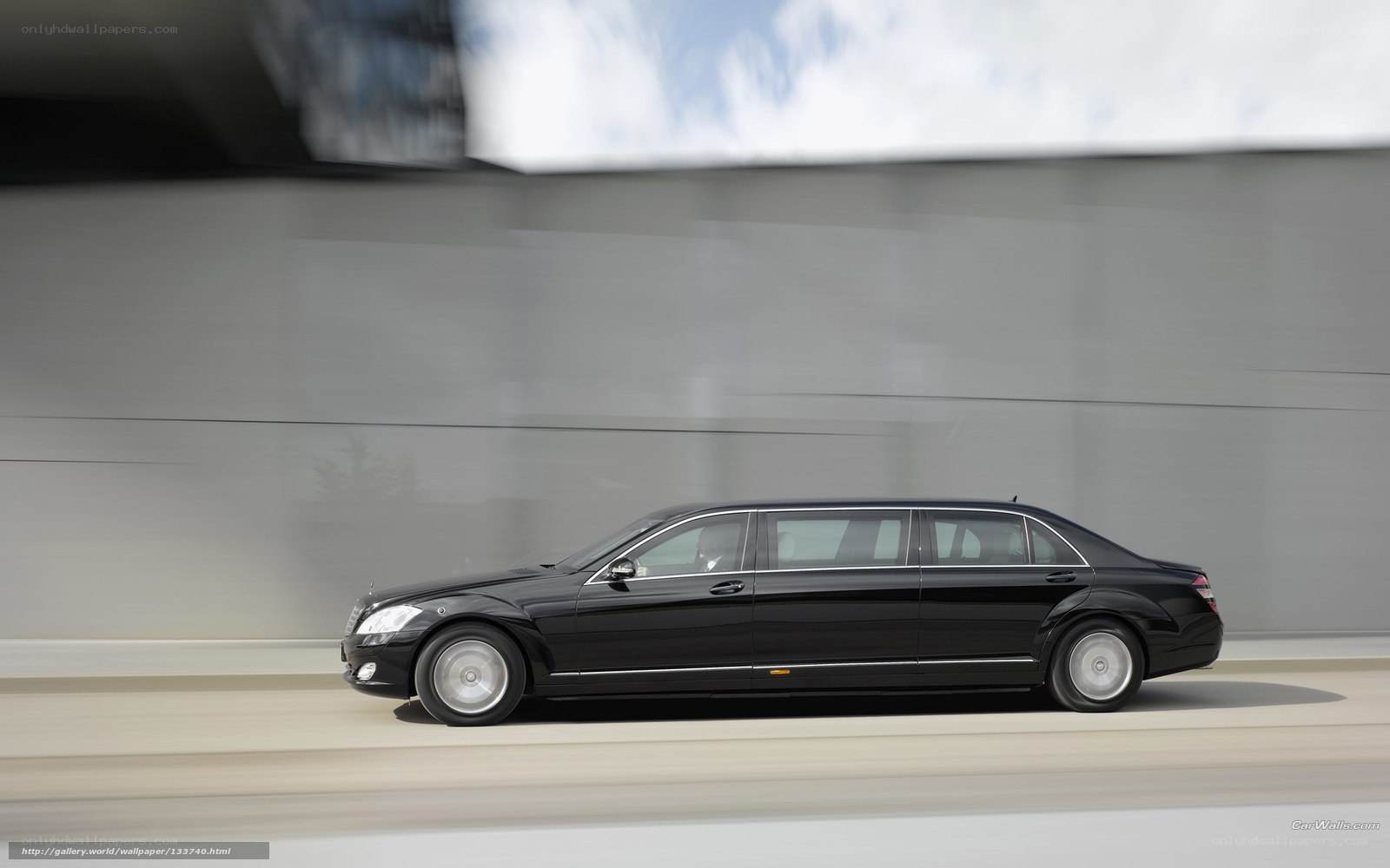 Black limousine in motion
