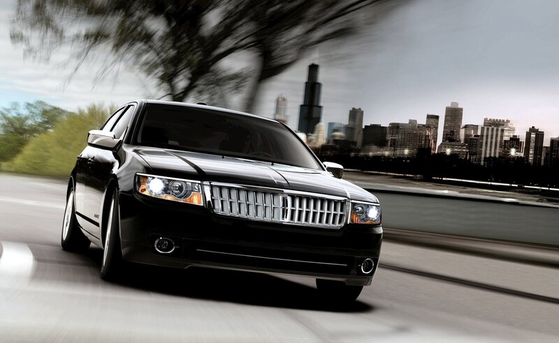 black lincoln driving in city