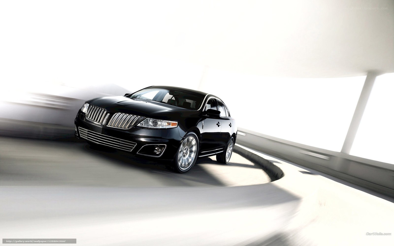 Black Lincoln sedan in motion