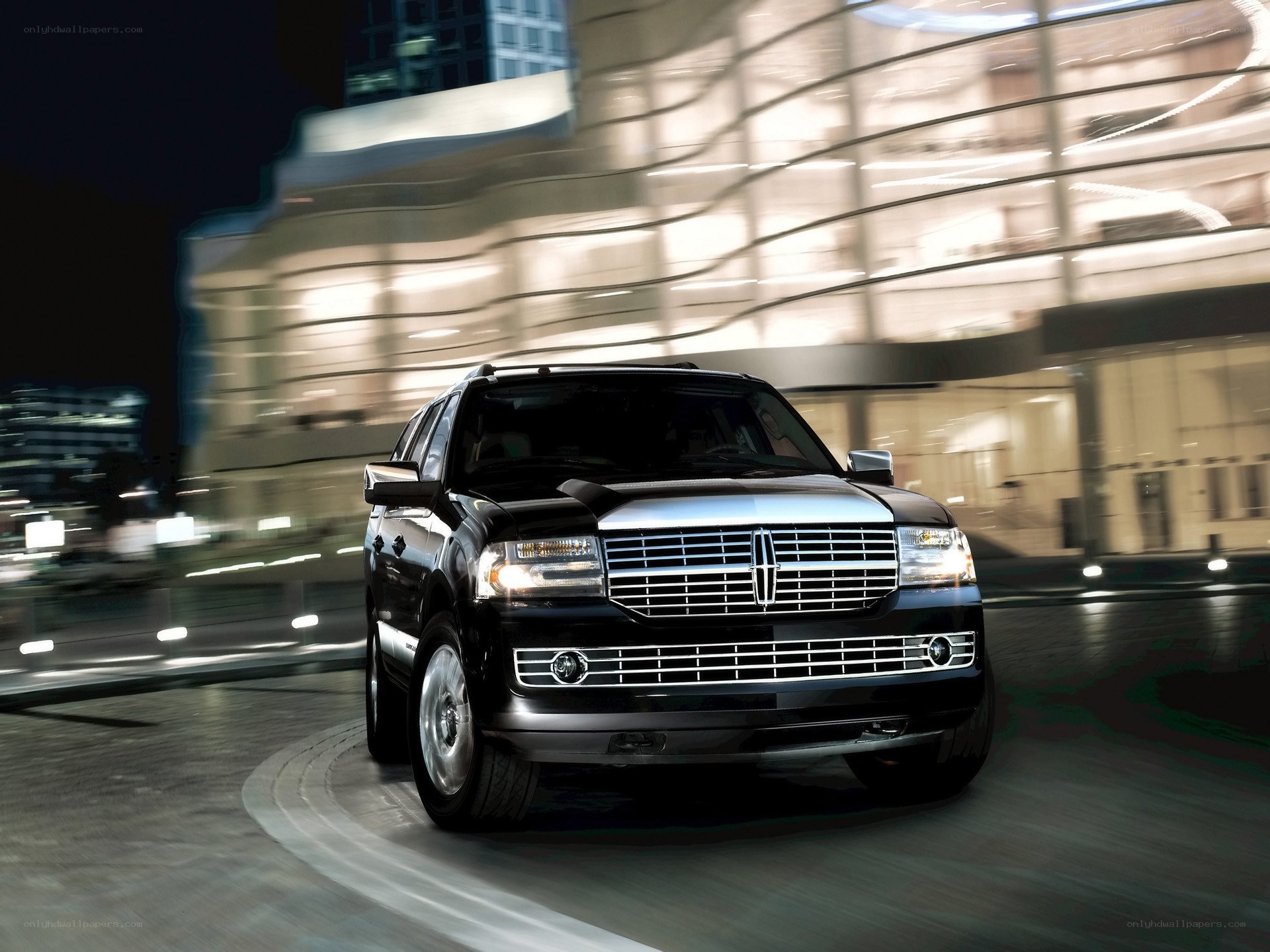 Black Lincoln SUV at night