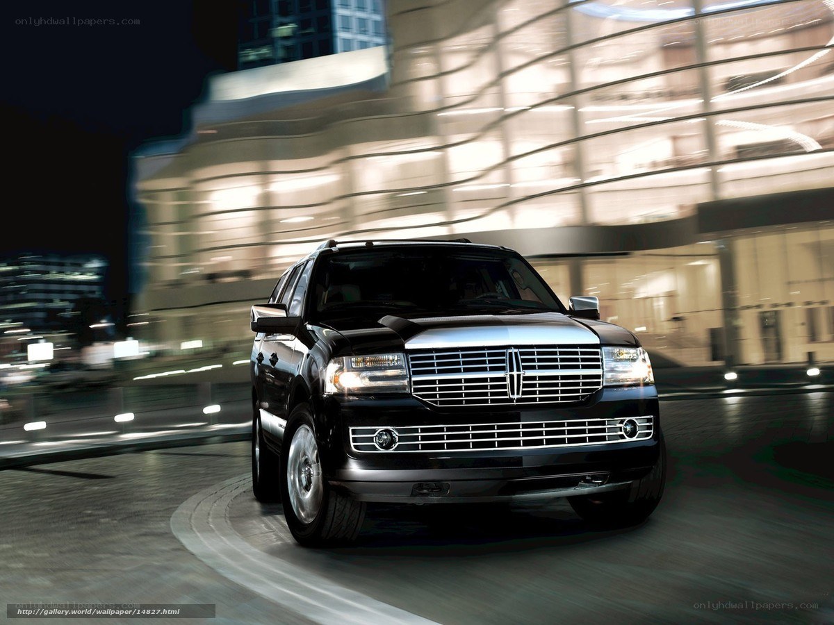 Black Lincoln SUV at night