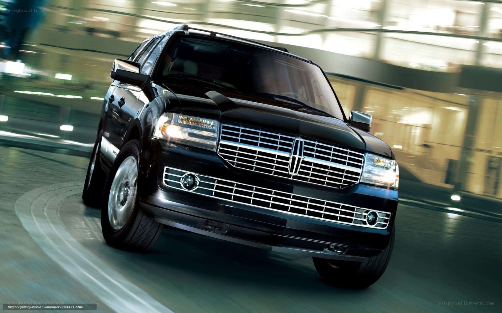 Black Lincoln SUV in motion