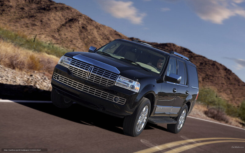 black lincoln suv on desert road