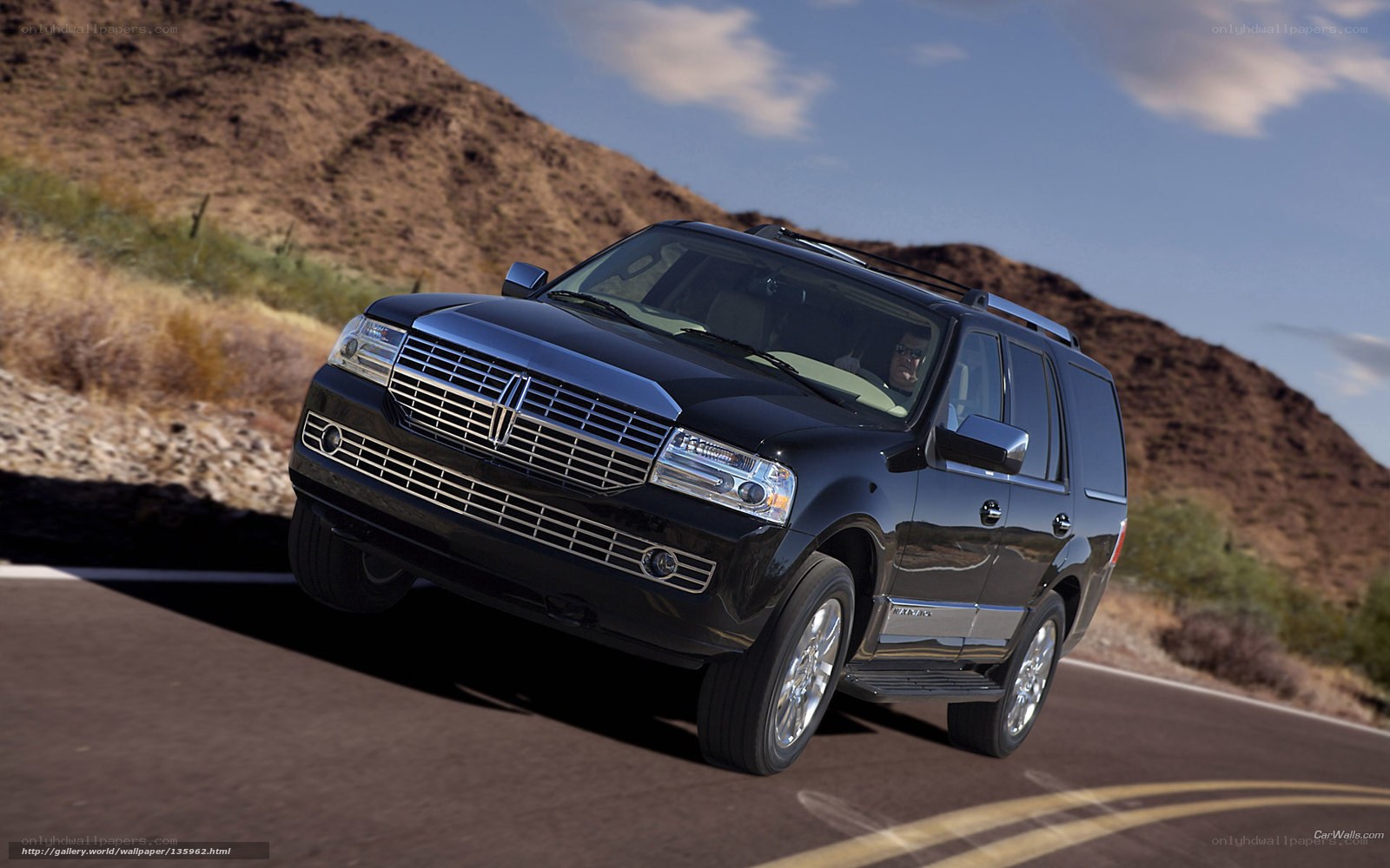 black lincoln suv on desert road