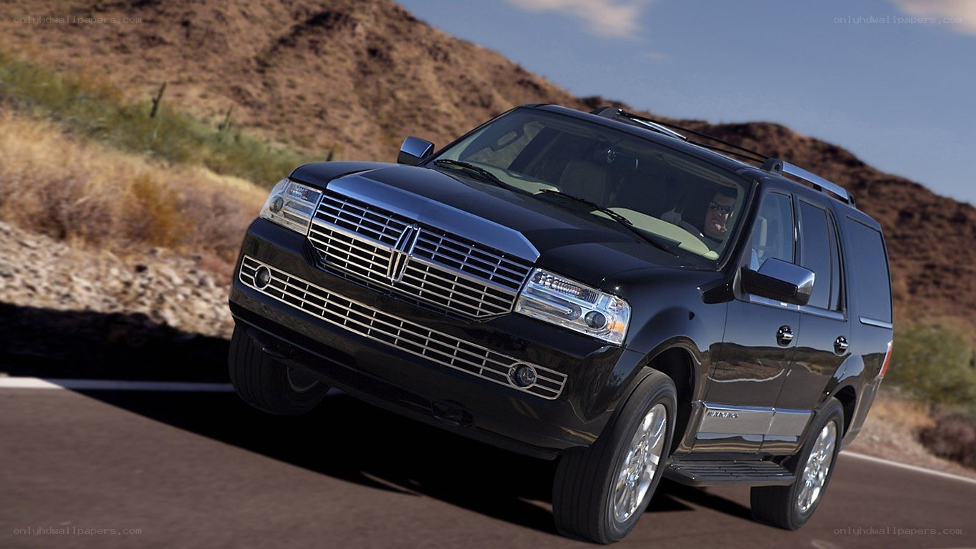 black lincoln suv on road