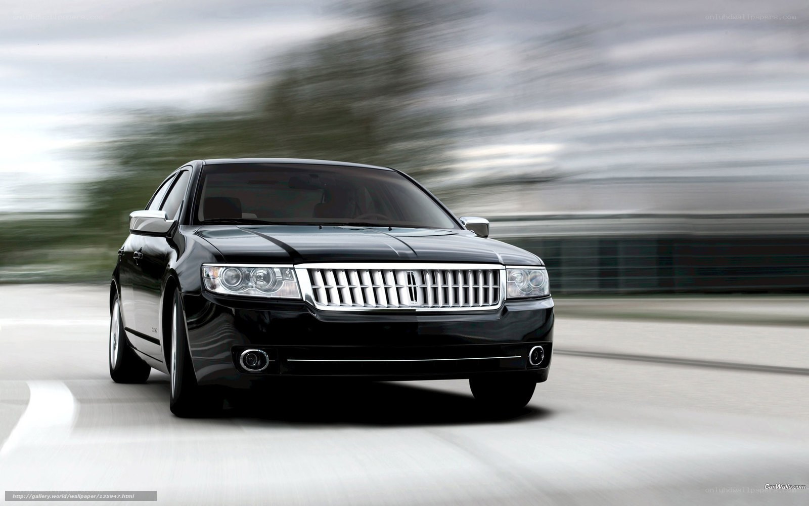 Black Lincoln Town Car in motion